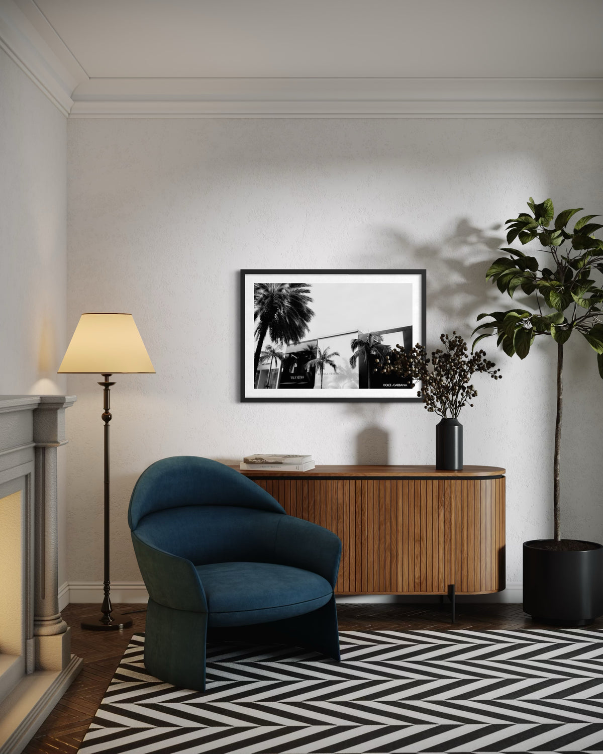 Blue Beverly Hills Luxe chair, wooden console, framed art, and plants in a Los Angeles living room.