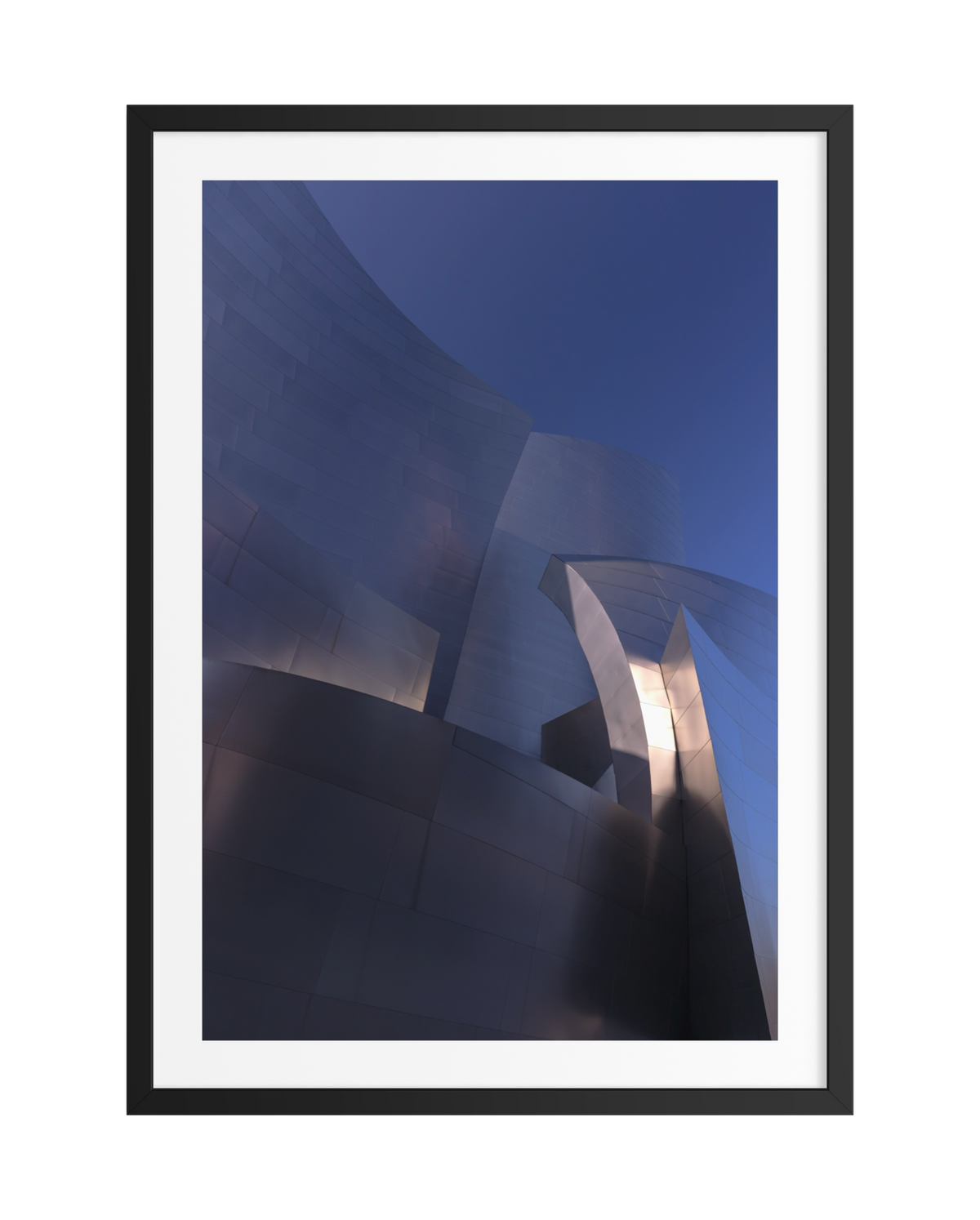 Curved metallic facade of Frank Gehry building in blue sky, outlined by a black frame, sunlight reflecting.