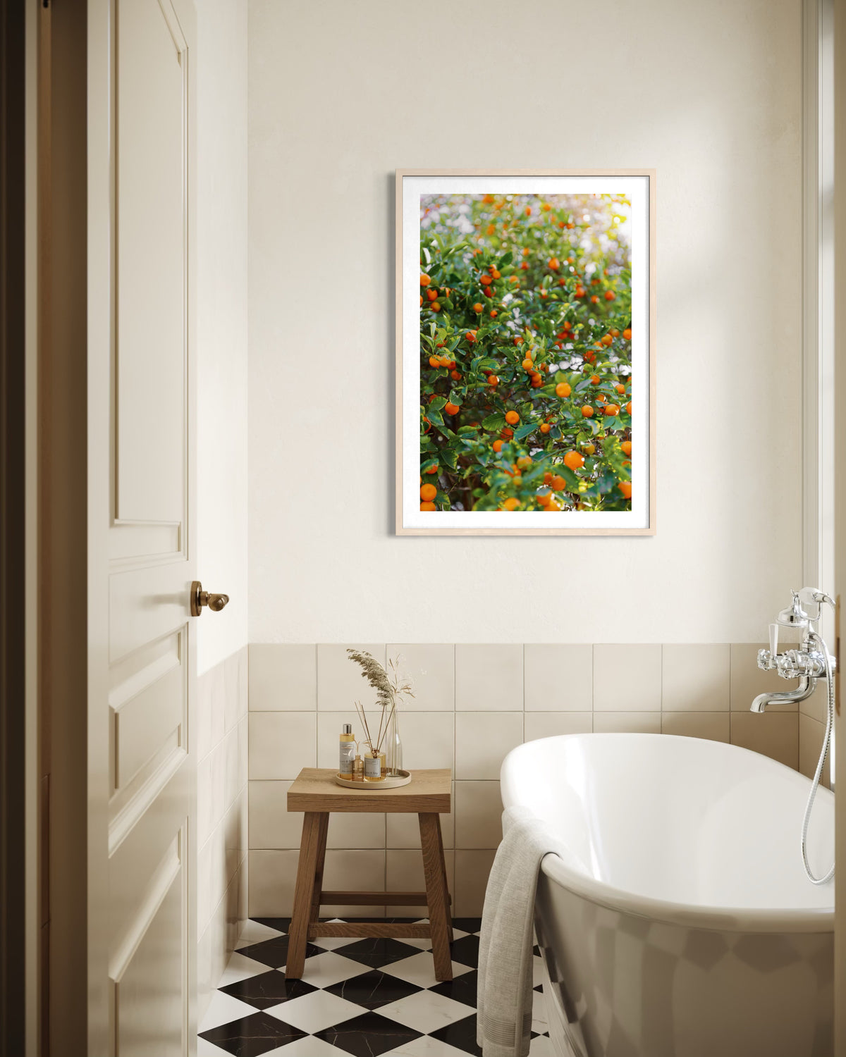 Framed Citrus Summer print featuring vibrant orange flowers displayed in a well-lit bathroom.