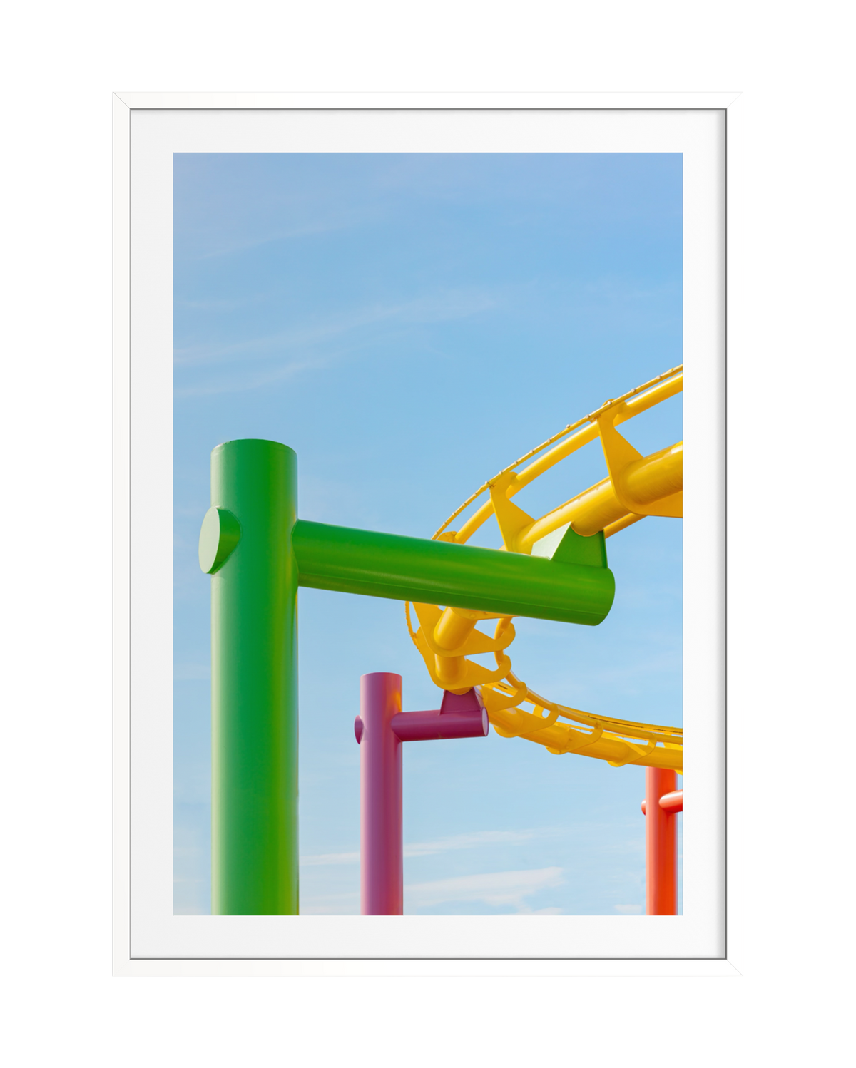 Santa Monica roller coaster with bright supports beneath a clear blue sky.