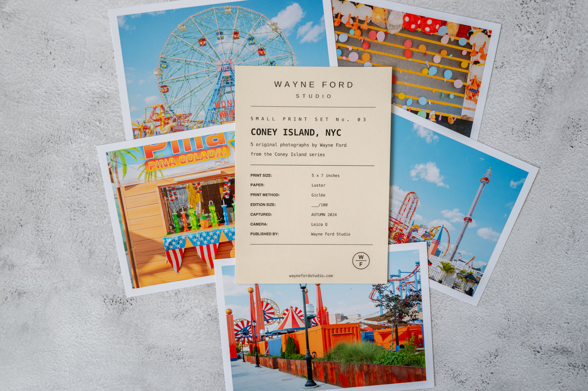 Coney Island boardwalk scene in New York; includes a small art print and separate studio info card.