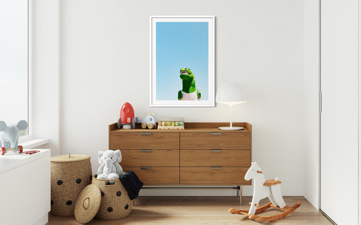Children’s room with toys, wicker baskets, and framed dinosaur art beneath a painted California sky.