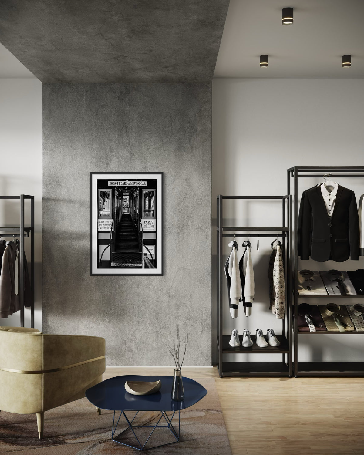 Clothes hanging in a modern closet, round table and yellow chair, with DTLA Funicular Passage framed on the wall.