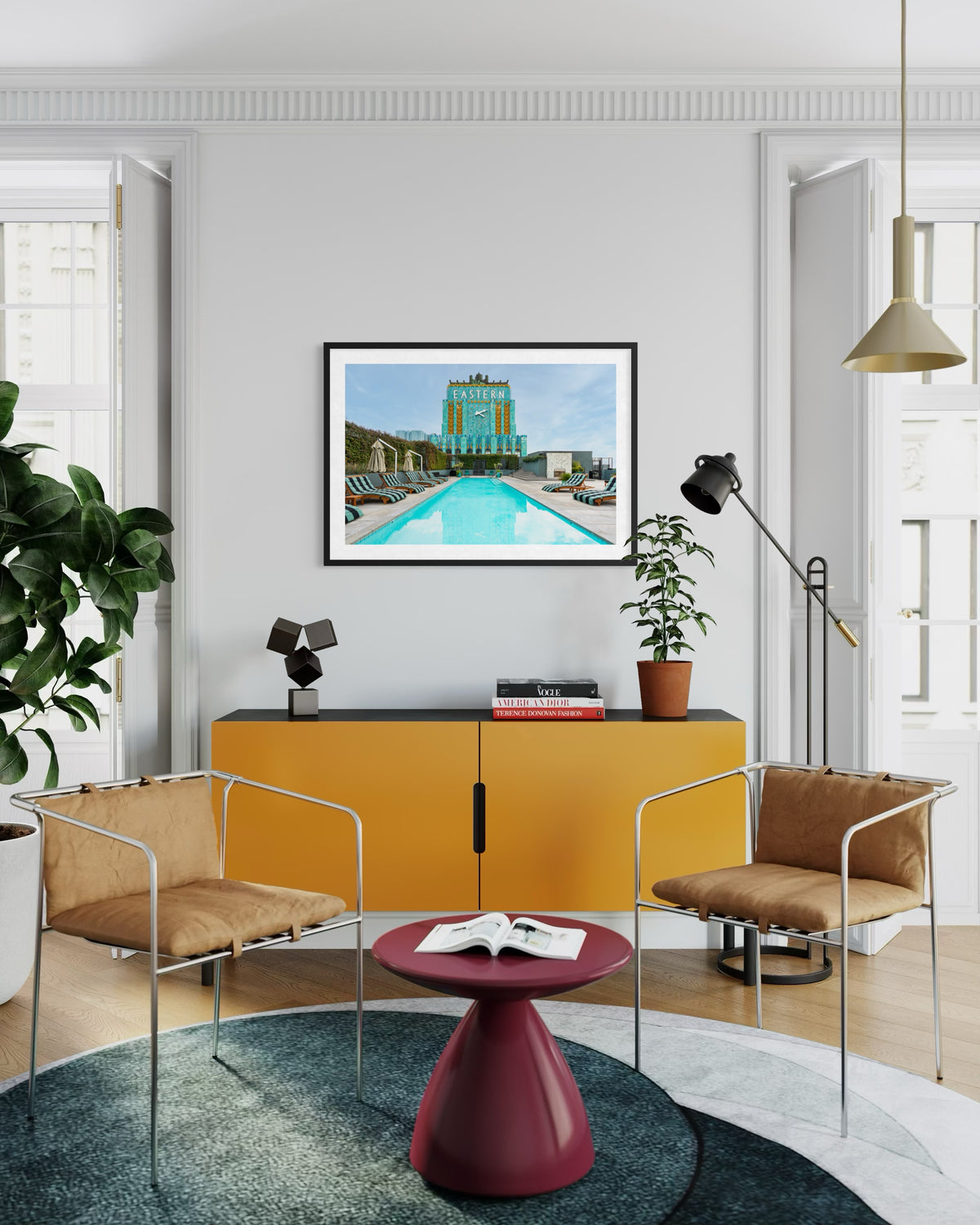 View of the Eastern Columbia Building in Los Angeles with green plants and two chairs in a living room.