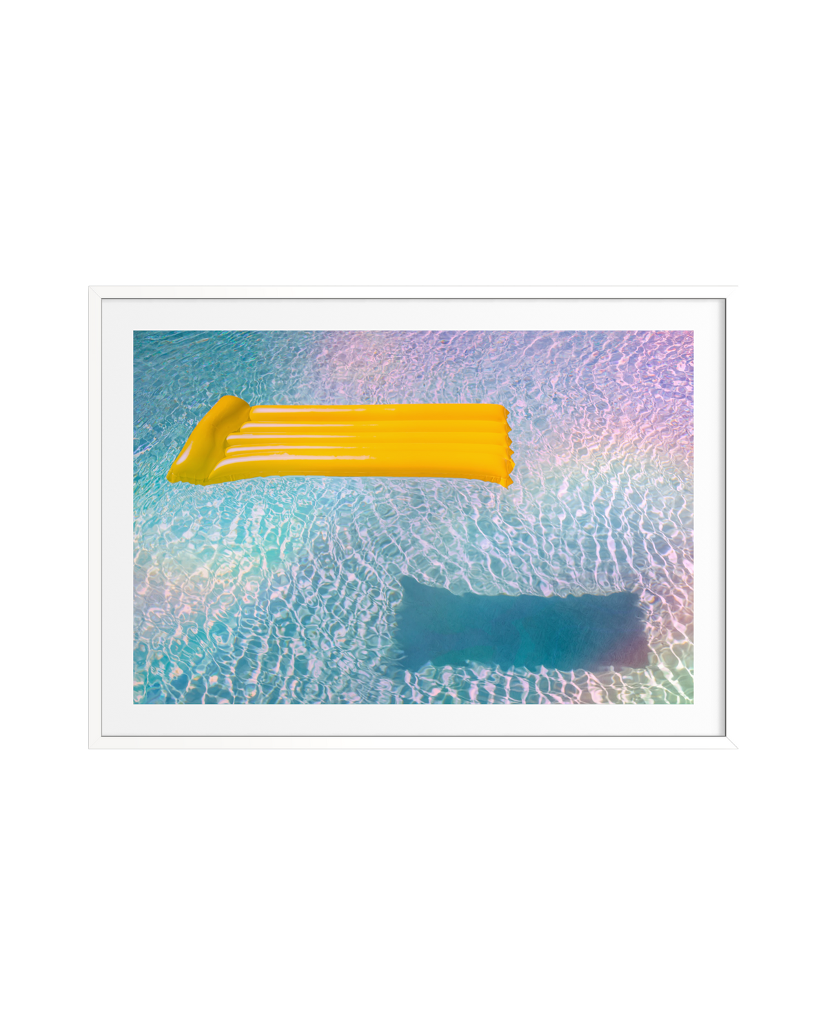 Yellow pool float on clear blue water from the Refractions Collection’s “Floating Through Summer” photograph.