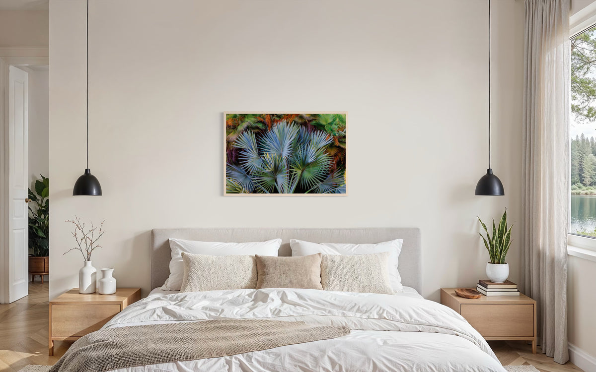 Gray bed with beige bedding, Footstool Palm, two nightstands, and natural decor in a modern bedroom.