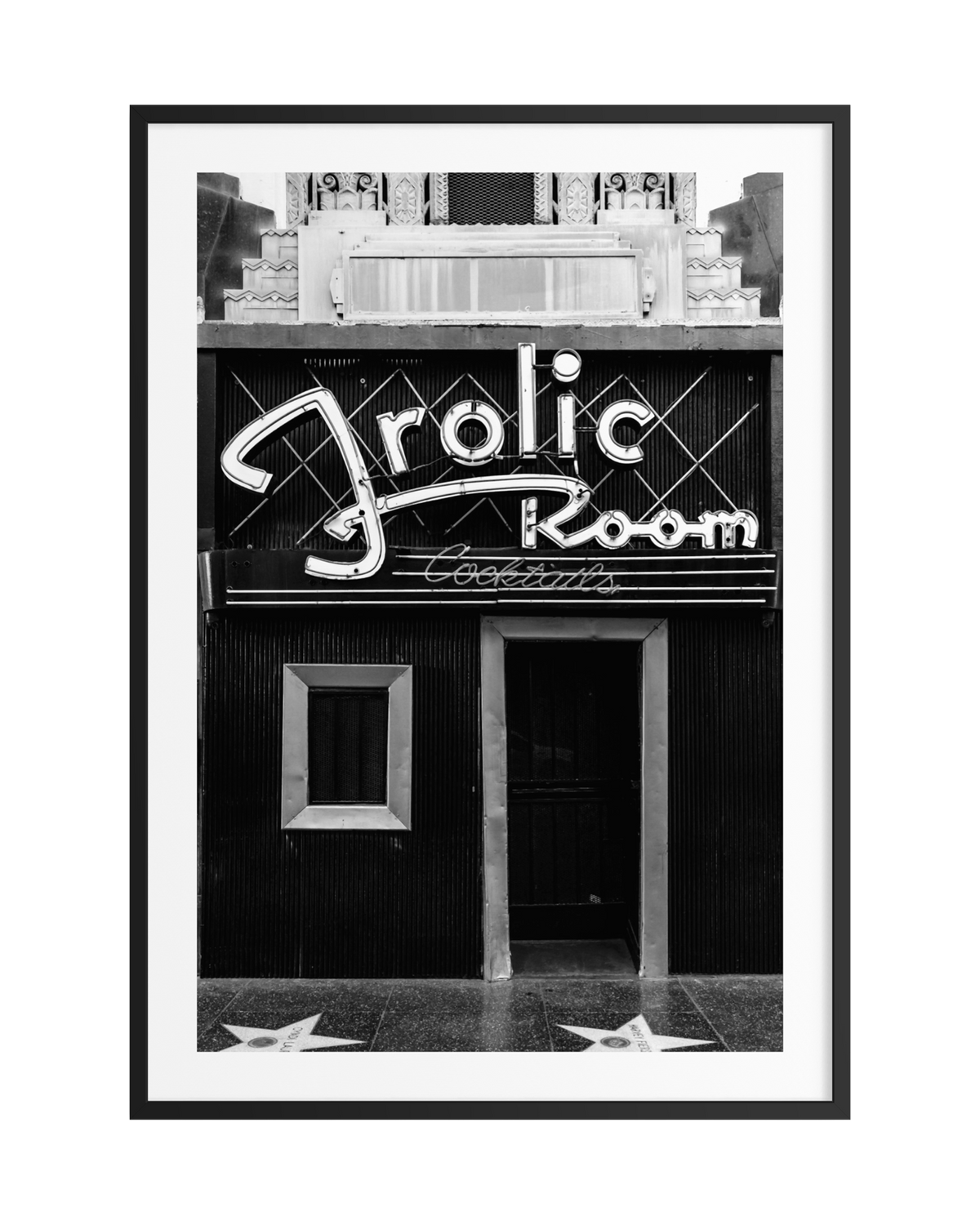 The Frolic Room’s neon-lit Art Deco entrance with Walk of Fame stars on Hollywood Boulevard, Los Angeles.