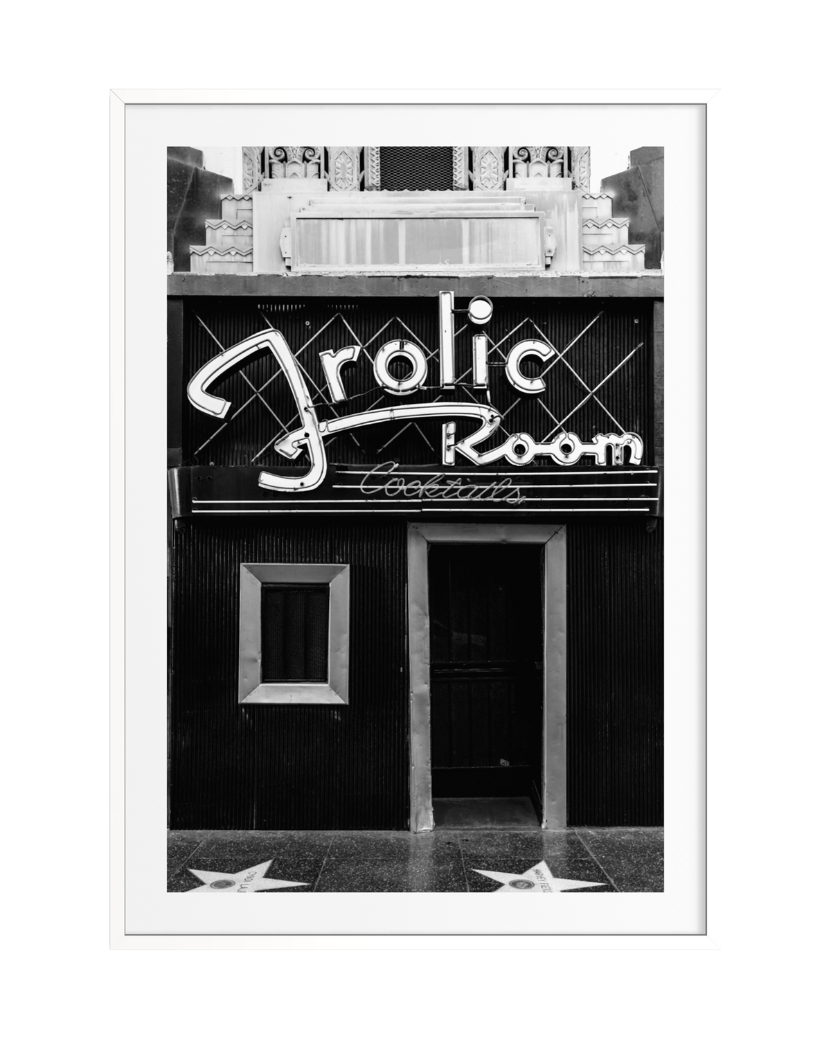 Frolic Room bar entrance in black and white with neon signs and Hollywood Walk of Fame stars, Los Angeles.