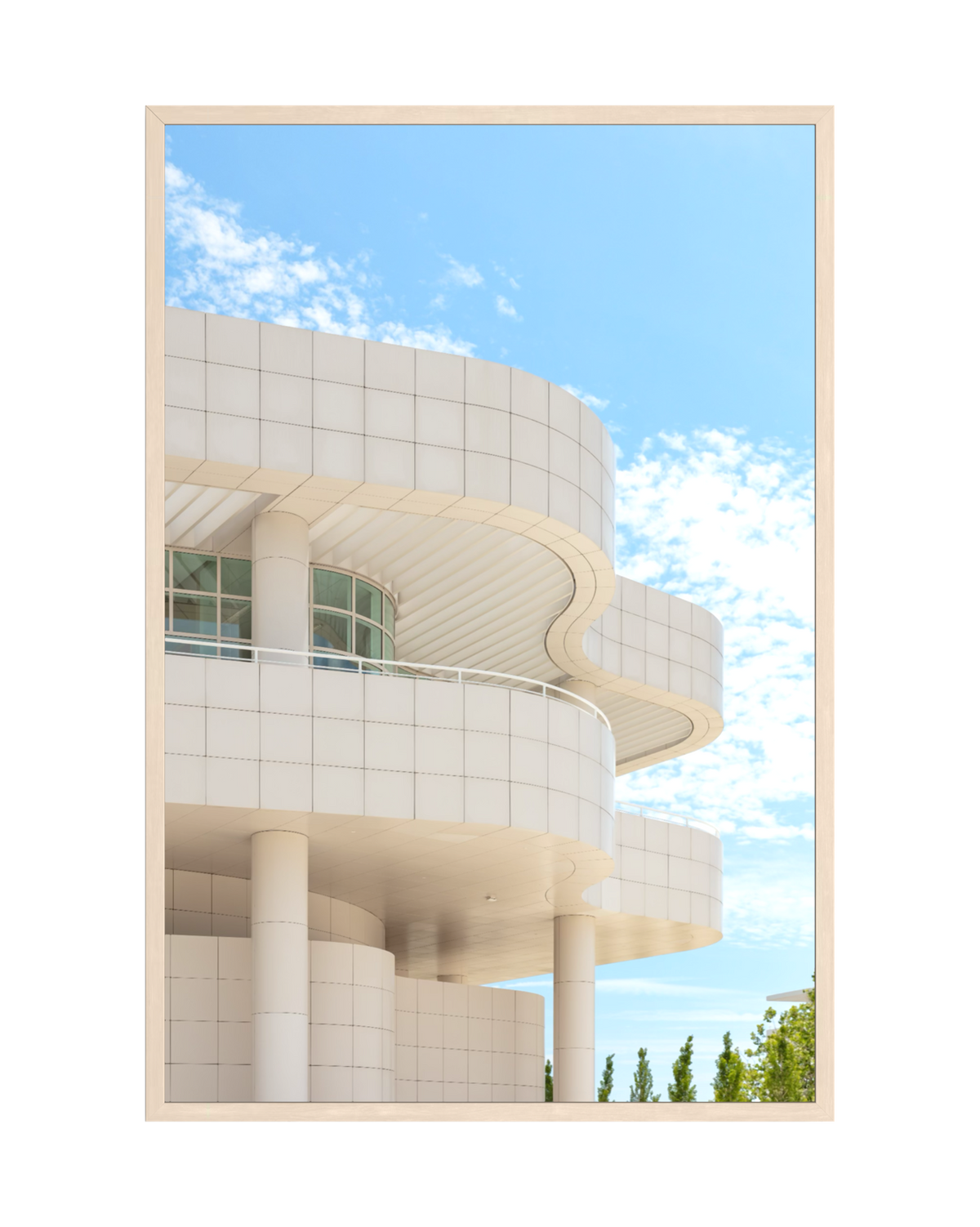 Curved white exterior of Getty Center in Los Angeles, featuring modern architectural lines against the sky.