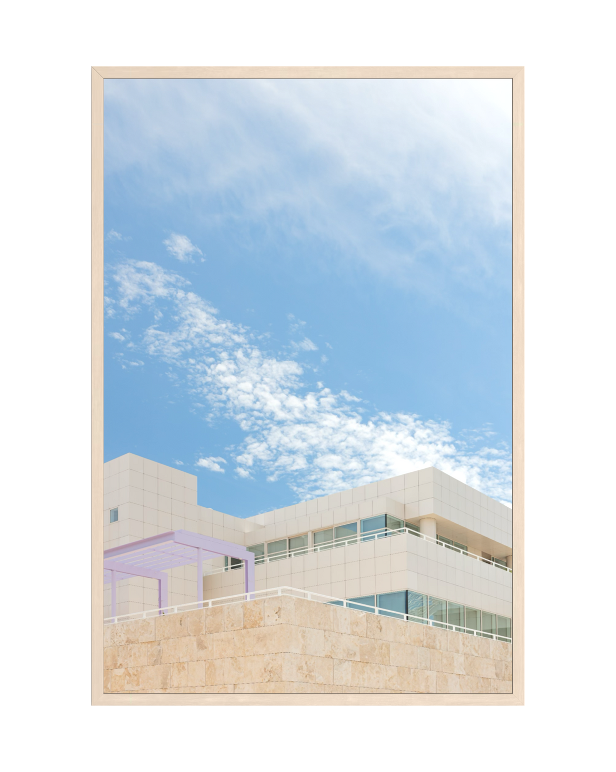 Modern white buildings with wood-framed windows and travertine details at the Getty Center, Los Angeles.