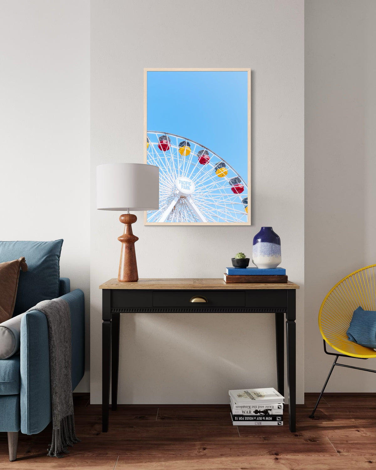 Framed “Going in Circles” print displayed above a wooden desk in a modern living room setting.