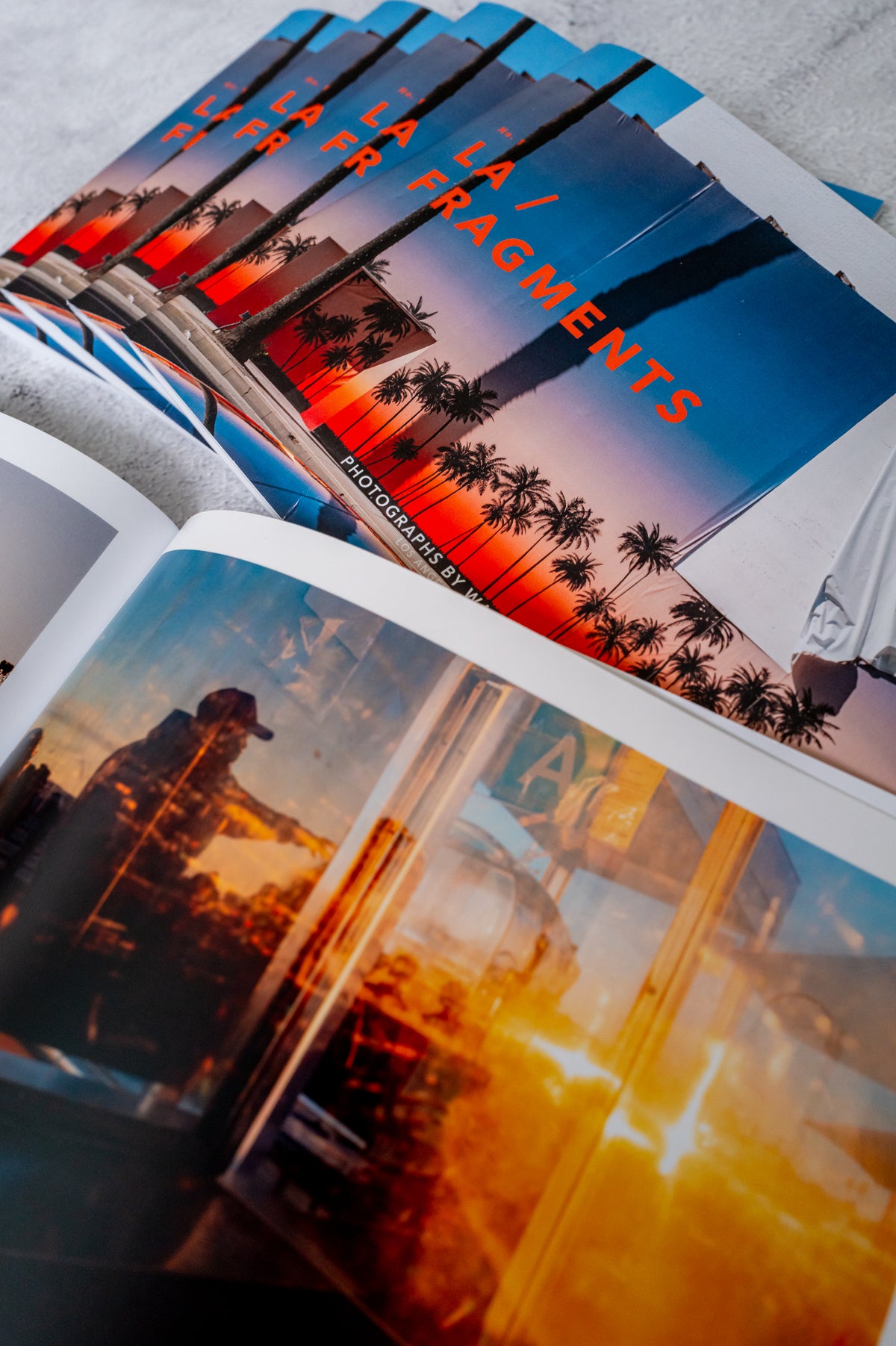 Photo zine with sunset city covers and a Los Angeles poster set, featuring views of LA at dusk.