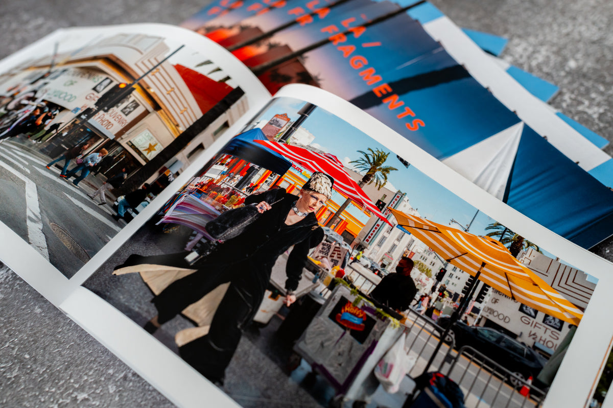 Street scene in Los Angeles featuring vibrant markets, from FRAGMENTS No. 1 LA street photography zine, on display.