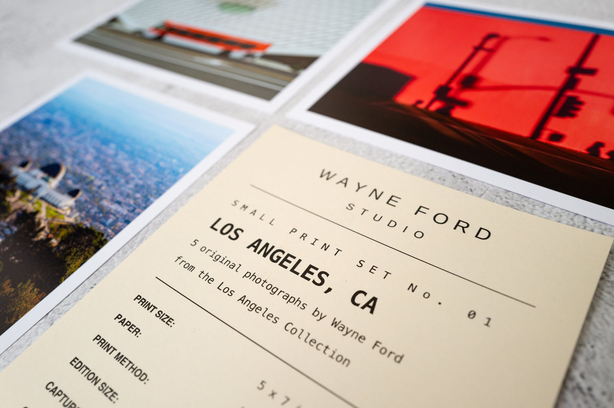Set of four Los Angeles prints and a Wayne Ford Studio label card, laid out together on a flat surface.