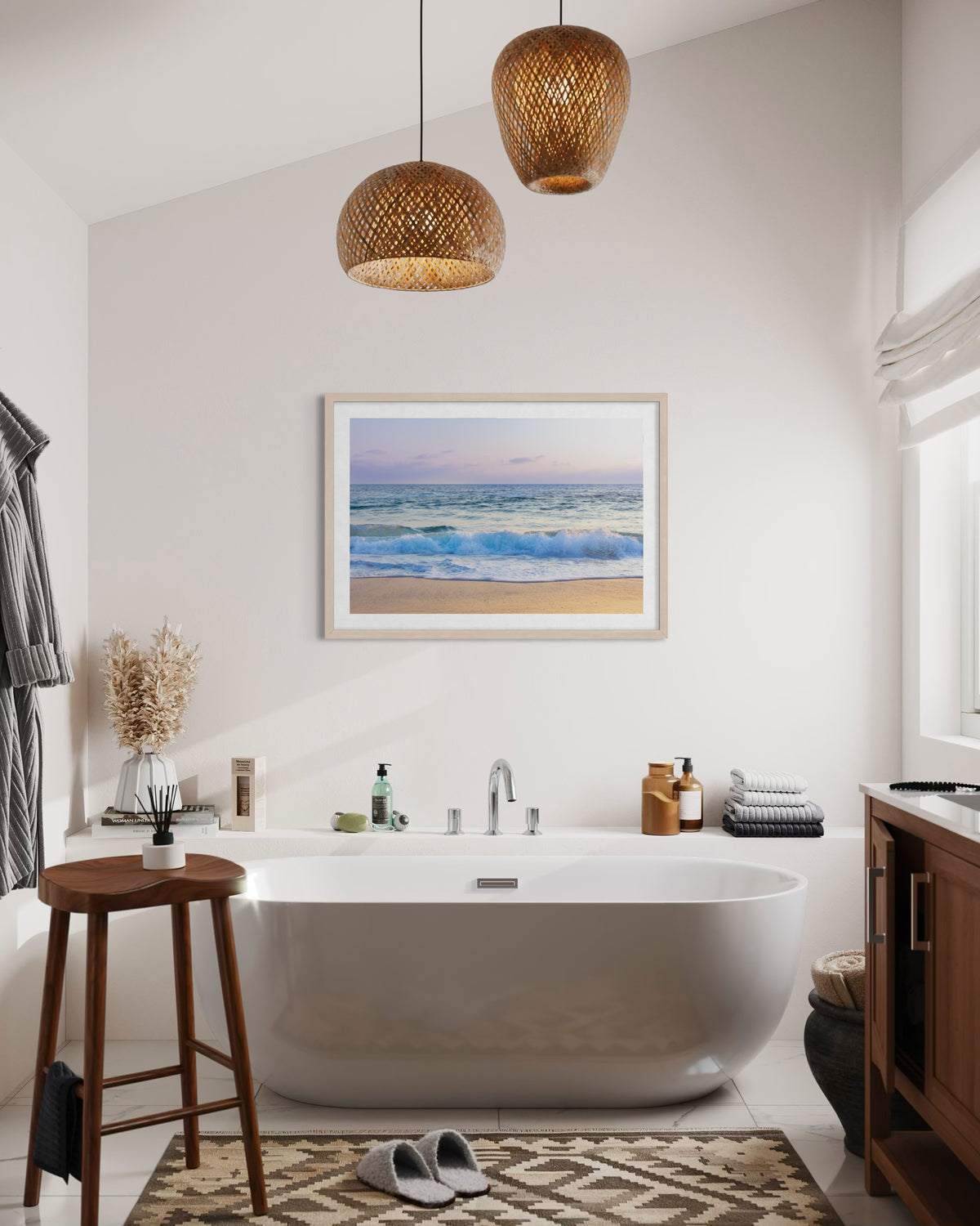 White bathtub, “Ocean Waves” wall art, pendant lights, and wood details in a modern bathroom.