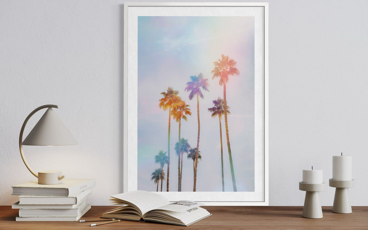 Pastel palm trees in Palm Springs, California, photographed against a clear sky.