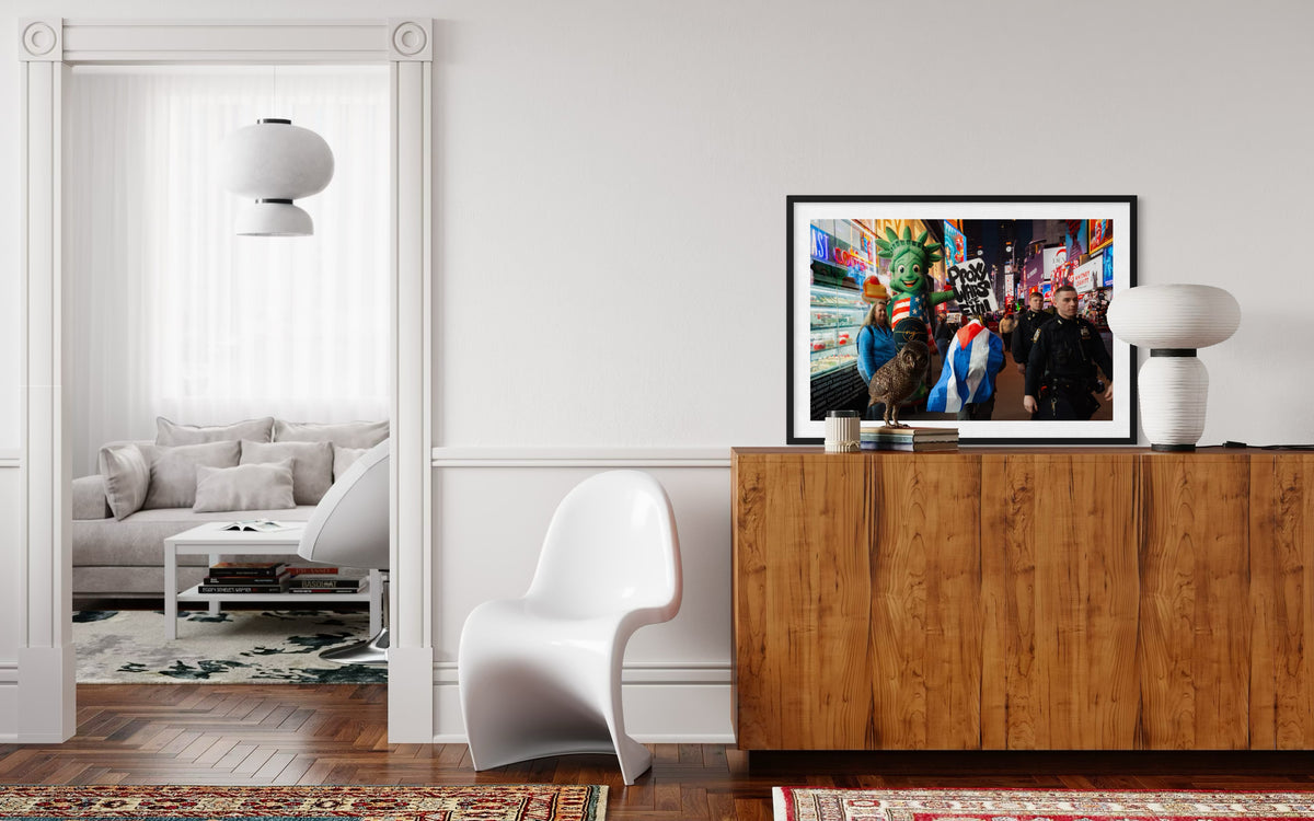 White chair, wood sideboard, and framed “Proxy Wars Are Evil” print in a brightly lit modern room.