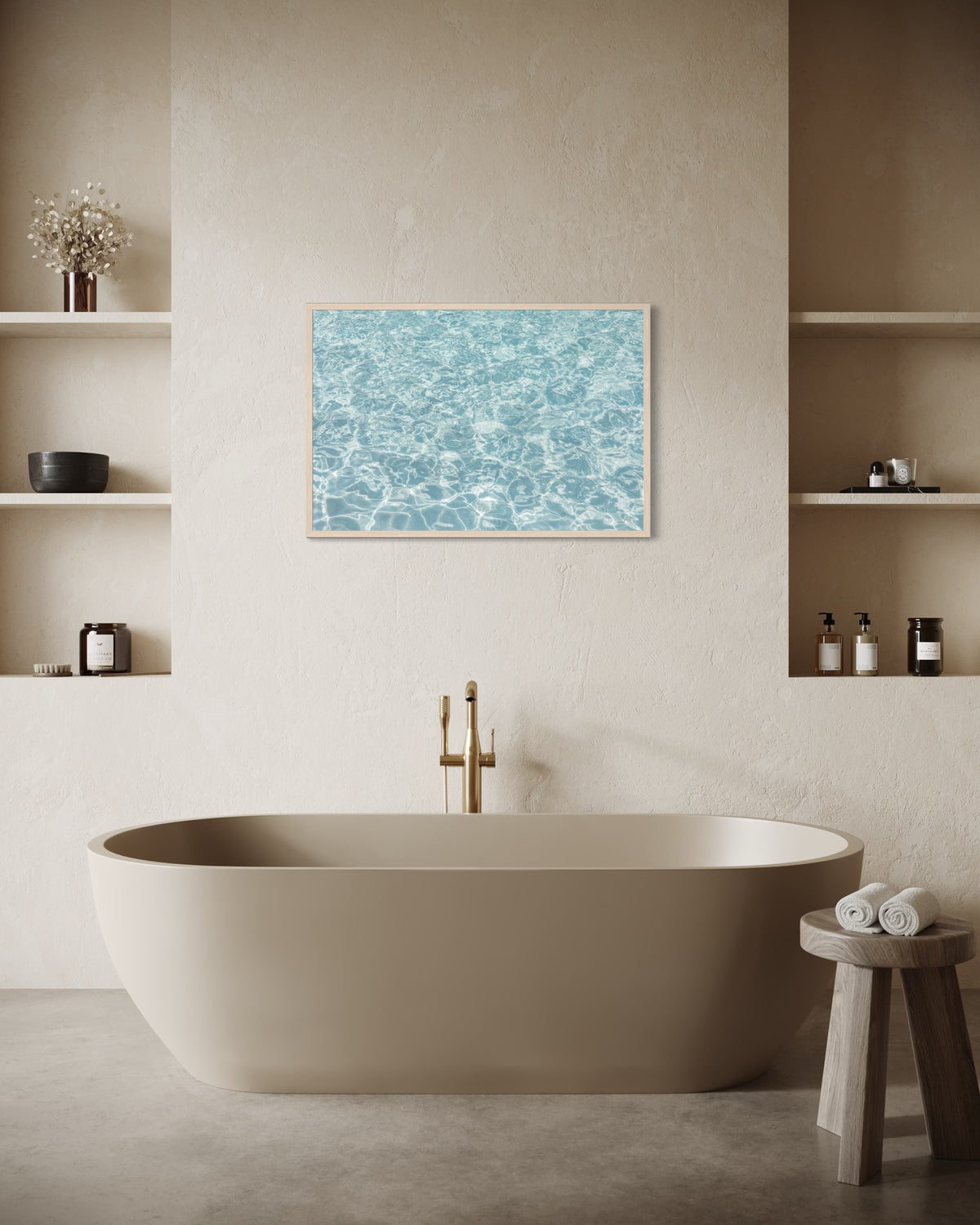 Freestanding bathtub with shelves and framed Refresh II water art mounted above in a minimalist bathroom.