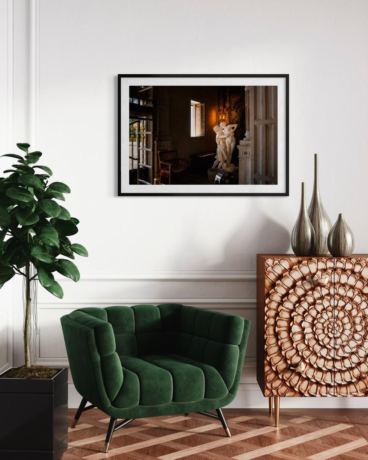 Stolen Kiss“ artwork above a green velvet chair, warm lamp, wooden cabinet with circles, and vases in a living room.