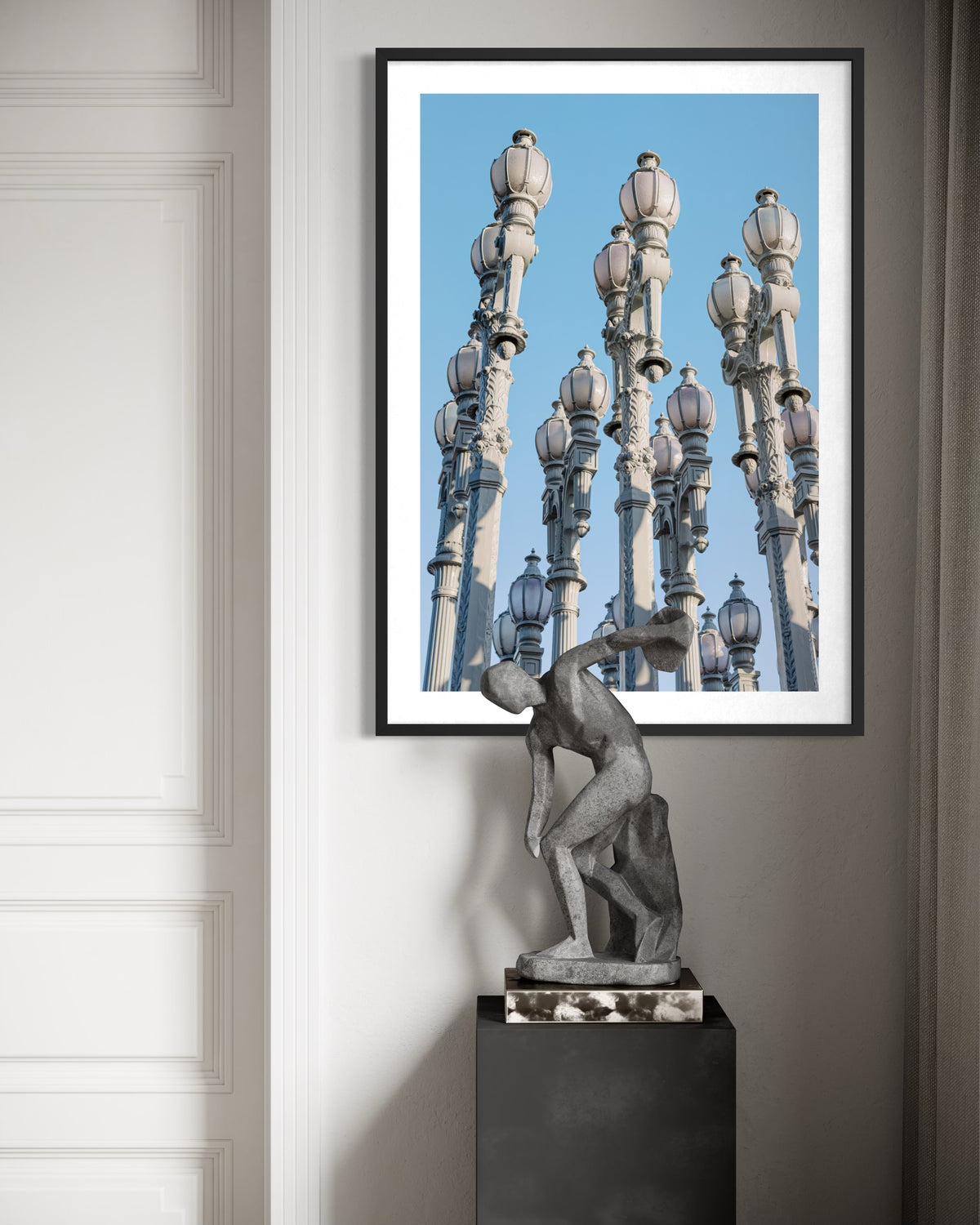 Los Angeles street lamps rise above a modern sculpture in a clean, minimalist scene from the “Urban Lights” series.