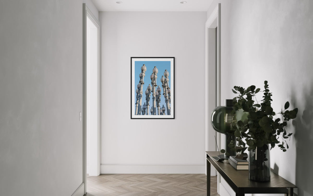 Framed photo of Urban Light installation’s architectural forms at LACMA in Los Angeles, displayed in a hallway.