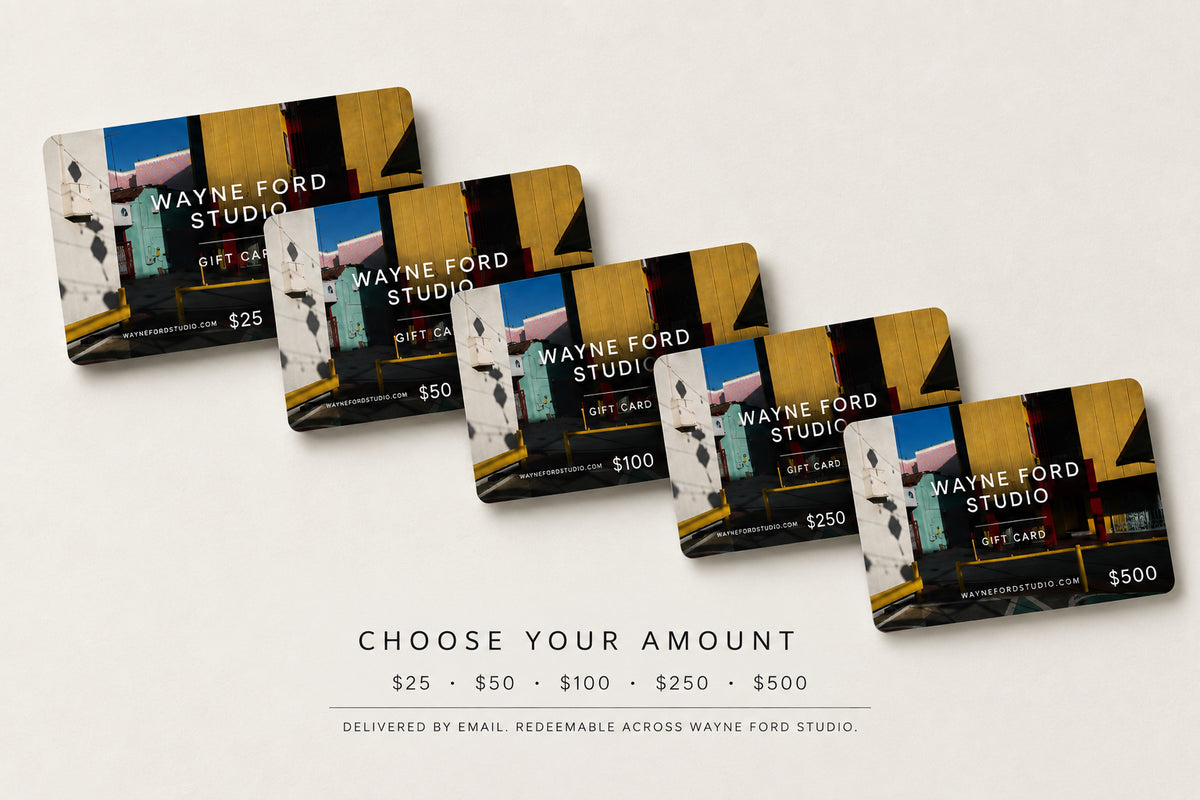 Five Wayne Ford Studio gift cards, $25–$500, arranged in a fan shape on a neutral background.