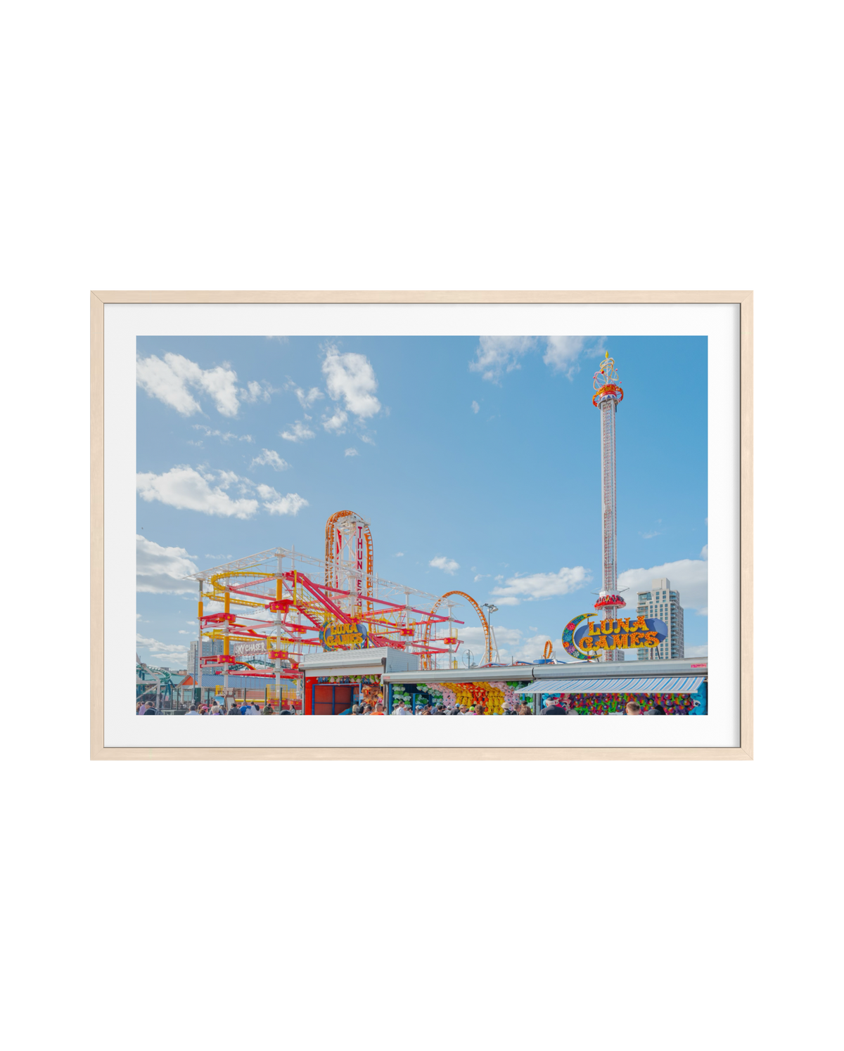 Roller coasters and rides fill Luna Park at Coney Island, Brooklyn, capturing its lively boardwalk atmosphere.