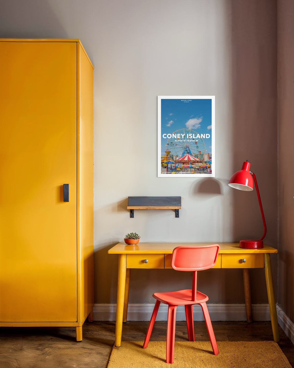 Yellow desk, red chair, lamp, yellow wardrobe, and Coney Island No. 03 poster on a beige wall in a New York room.