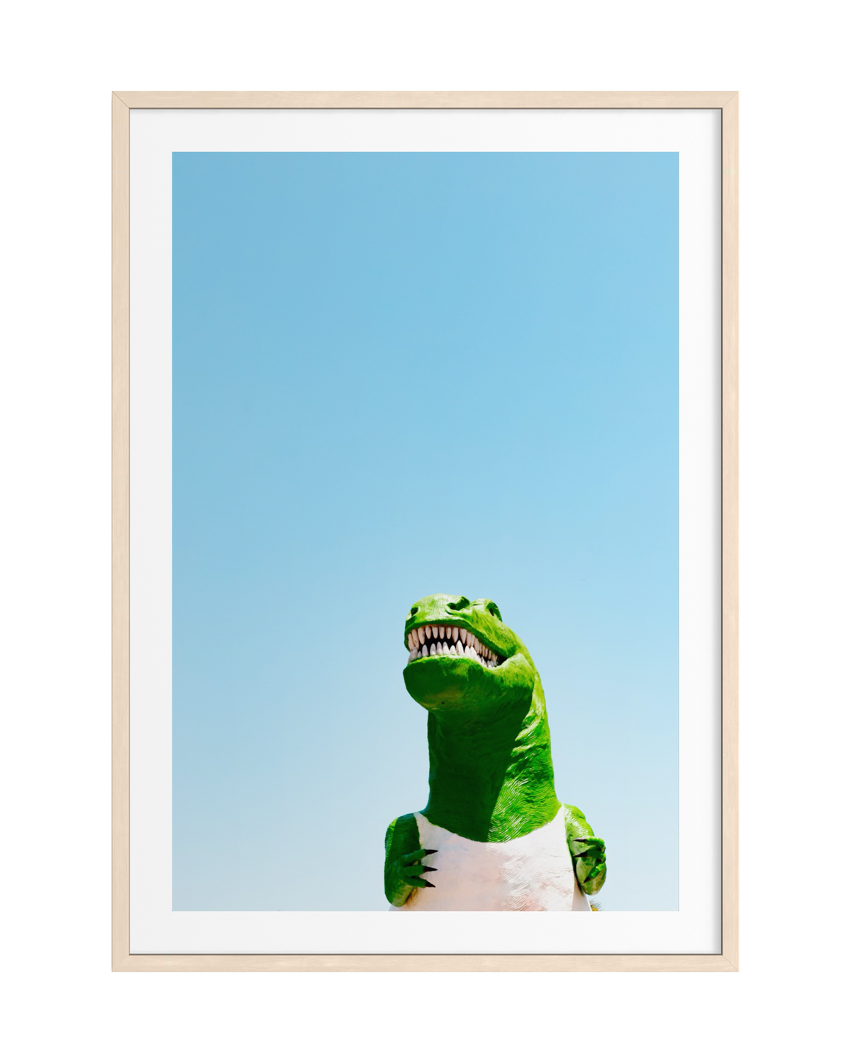 Large dinosaur statue in Cabazon, California, viewed from below and framed with wood against the sky.