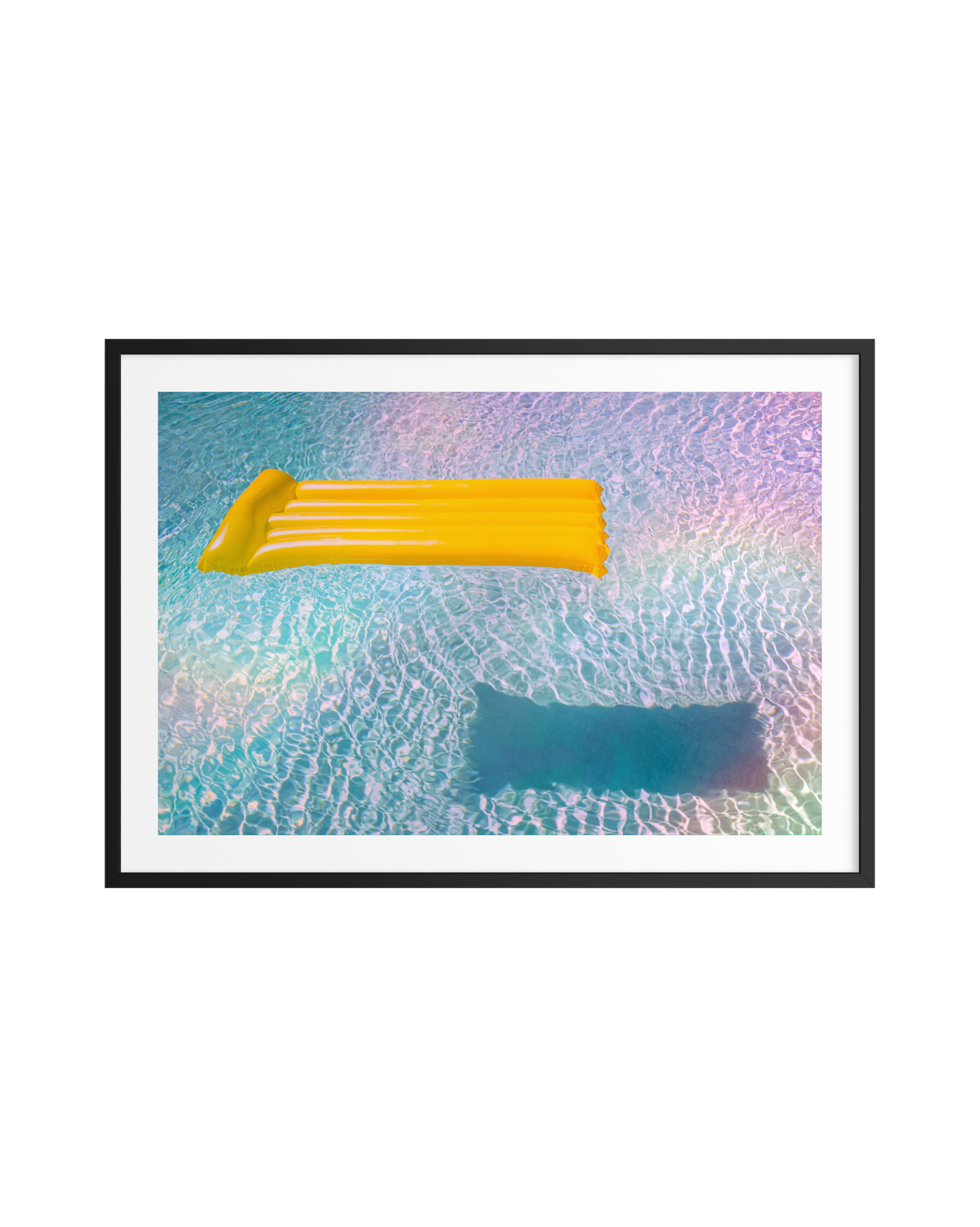 Yellow pool float casting soft shadows on bright blue water in an experimental photograph.