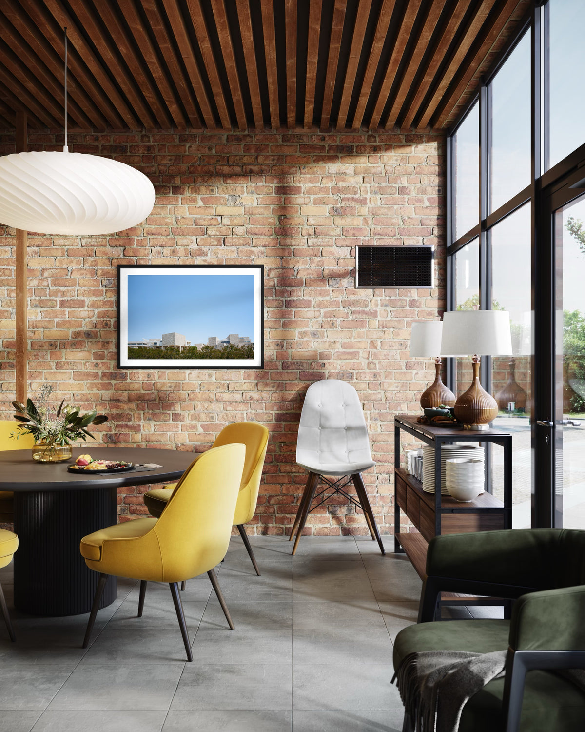 Dining area with yellow chairs and brick walls; Getty Center III cityscape photo of Los Angeles on display.