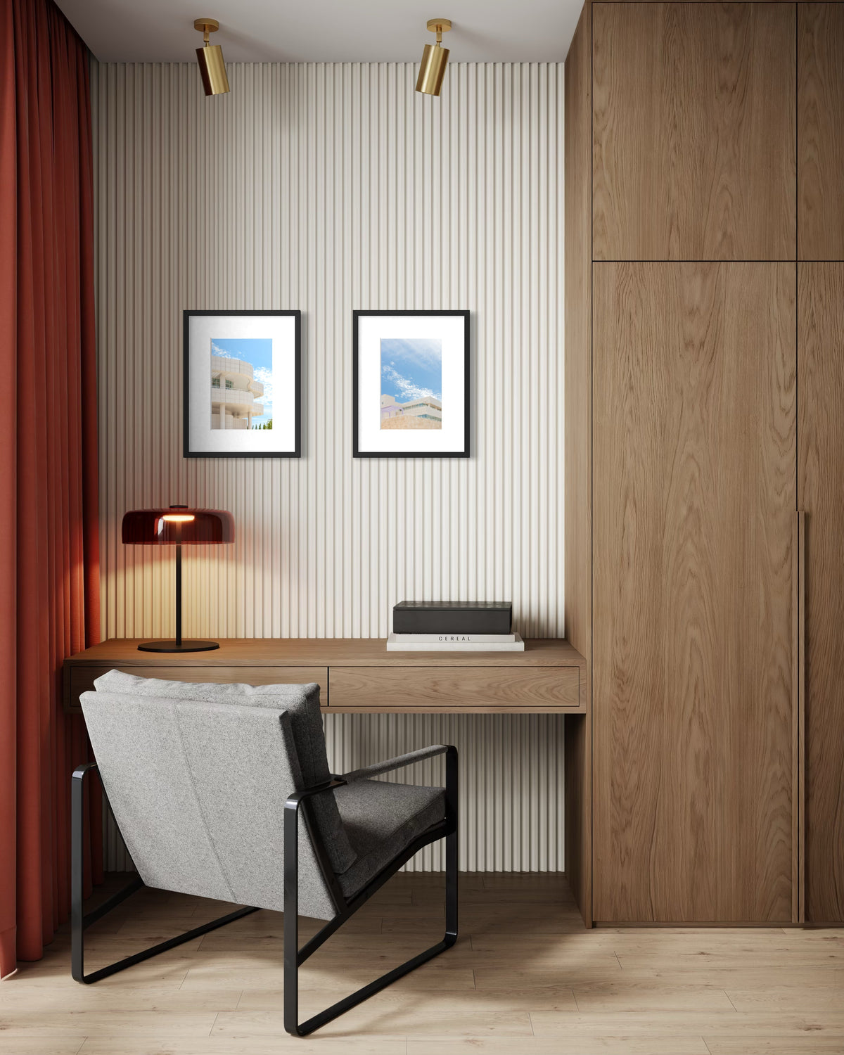 Wooden desk, gray chair, and red lamp in a modern home office; Getty Center artwork on striped wall.