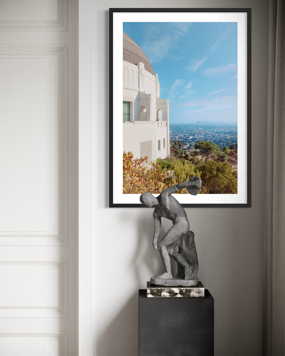 Griffith Observatory overlooking Los Angeles, with a modern sculpture in the foreground.