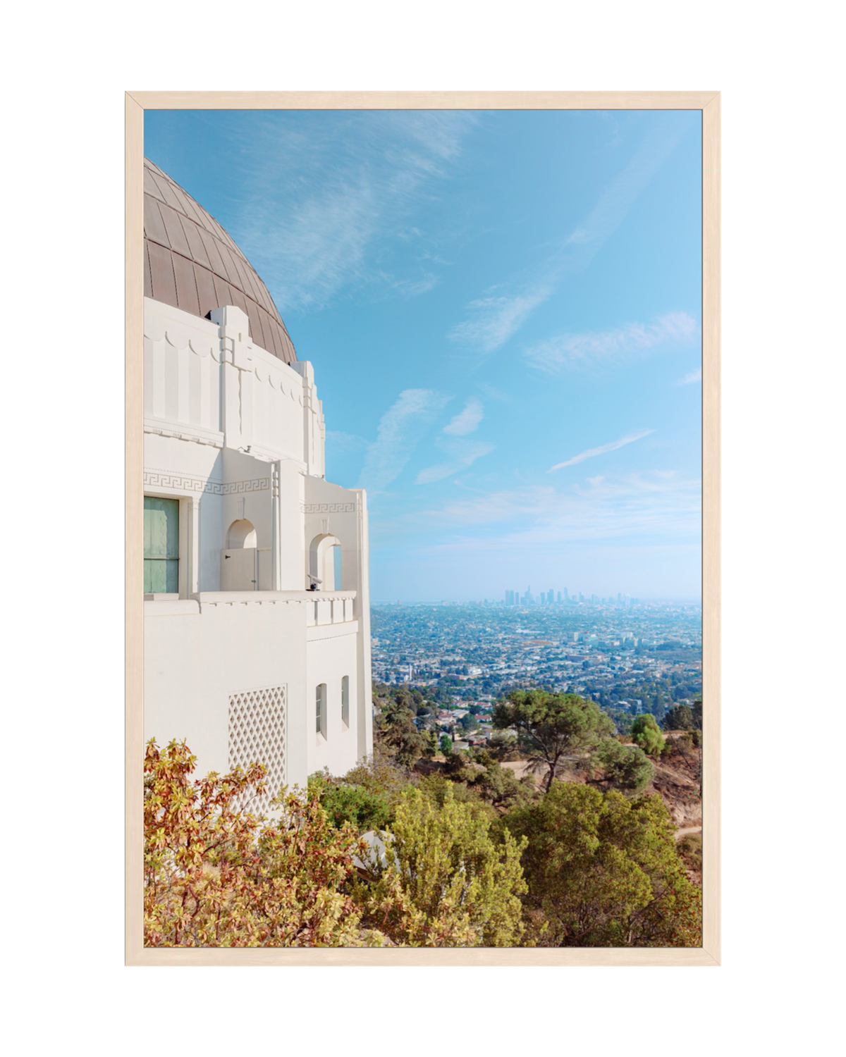 Downtown Los Angeles viewed from Griffith Observatory under a clear blue sky.