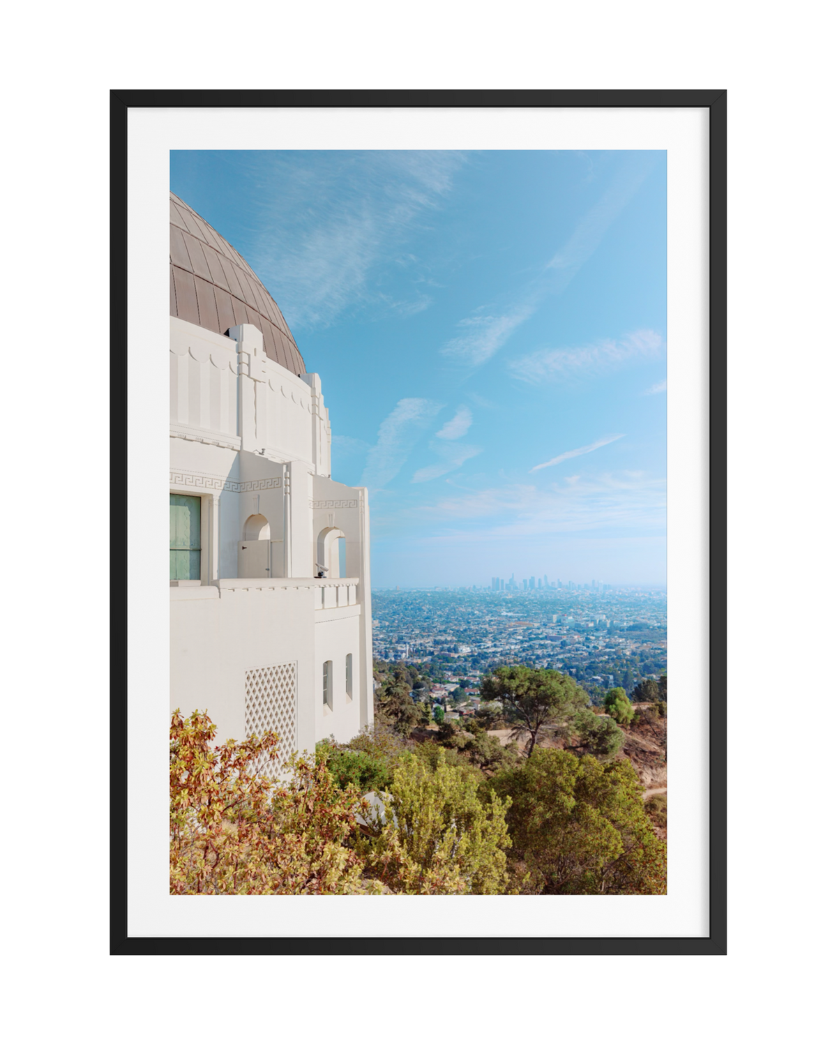 Framed photo of Los Angeles skyline with clear blue sky, seen from Griffith Observatory.