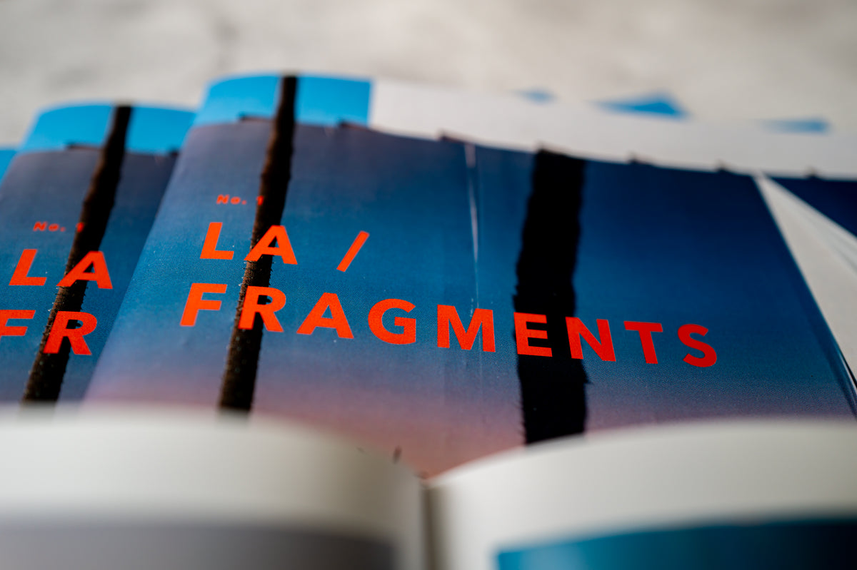 Bold red LA / FRAGMENTS No. 1 text on blue cover, street photography zine from Los Angeles.