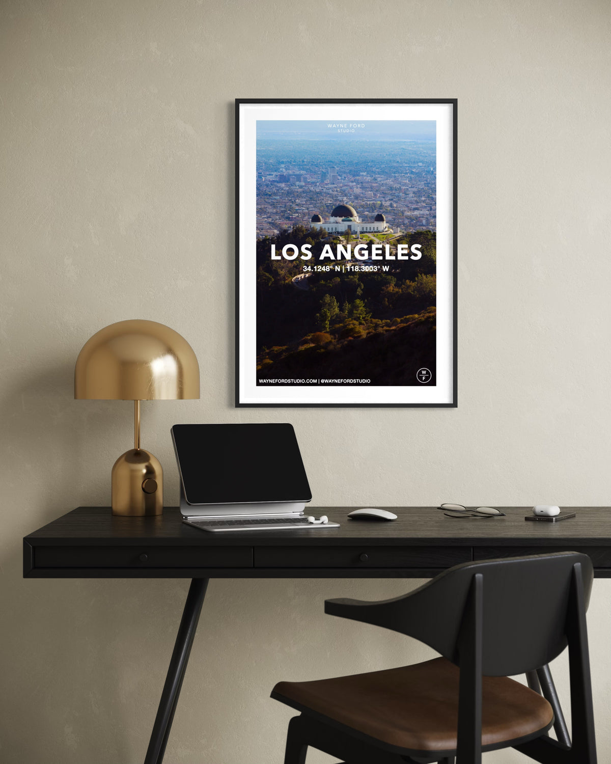 Framed print of Los Angeles’ Griffith Observatory above a black desk in a modern room setting.