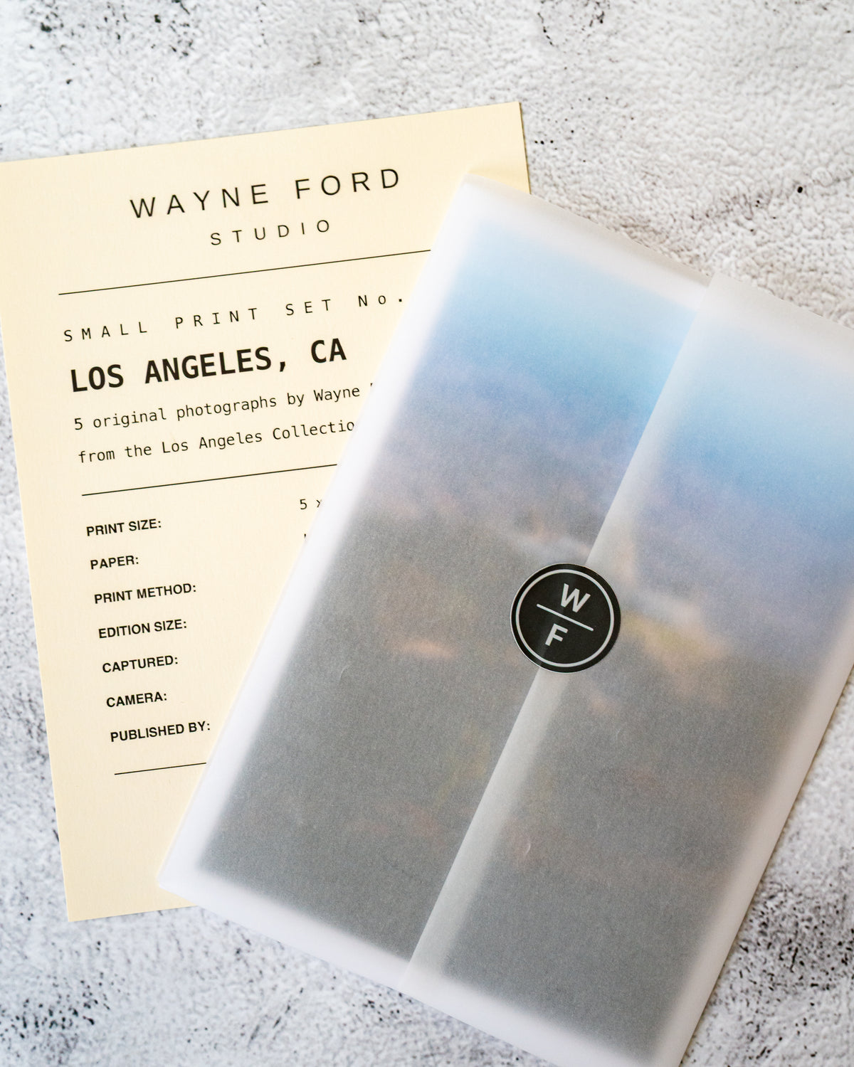 Los Angeles Small Print Set / No. 01 and info card on a textured surface in Wayne Ford Studio display.