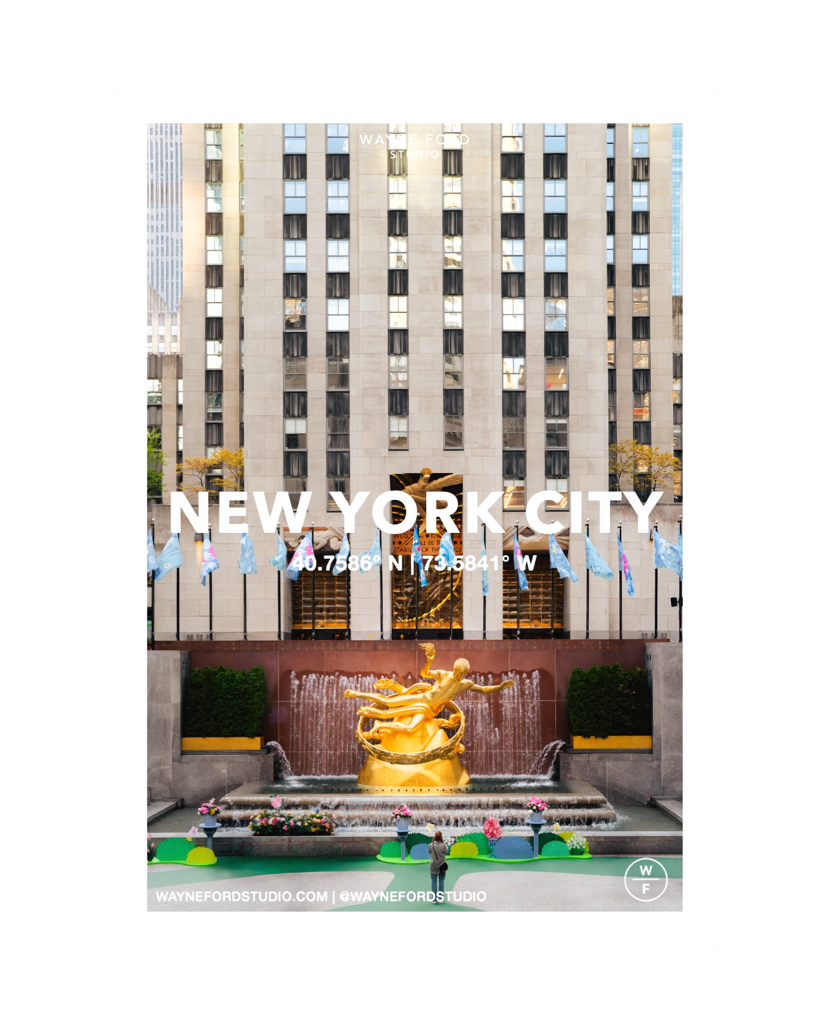 Rockefeller Center in New York City with the Prometheus statue and colorful flowers in the foreground.