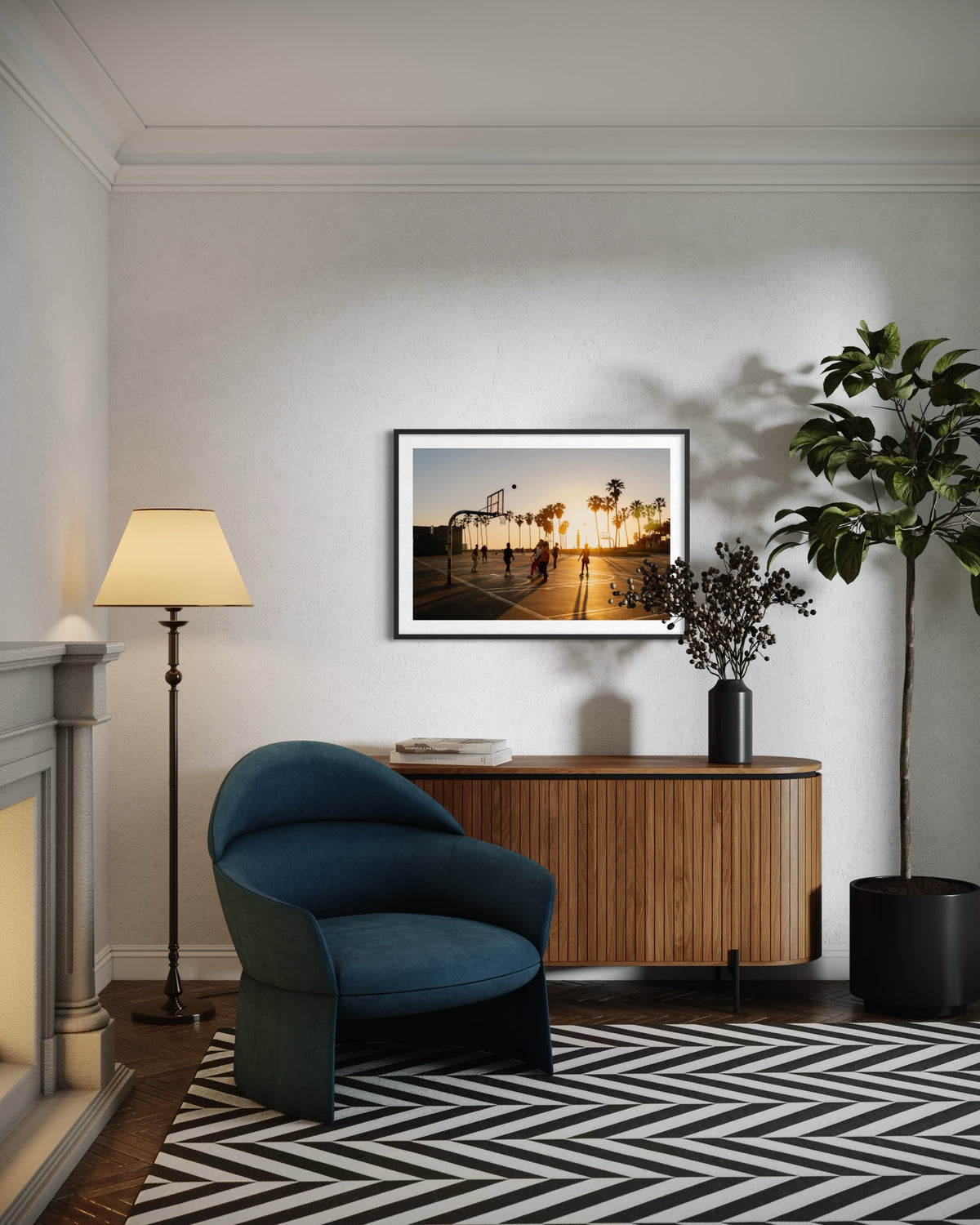 Framed Venice Beach photograph on wall above blue chair and wood sideboard in a modern living room.