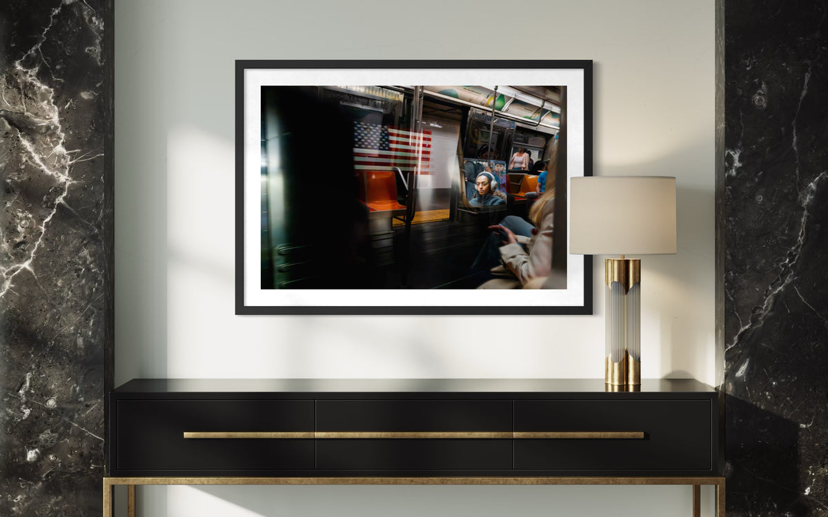 A passing train moves through New York City, captured in a photograph titled “Passing Train, New York City.”.