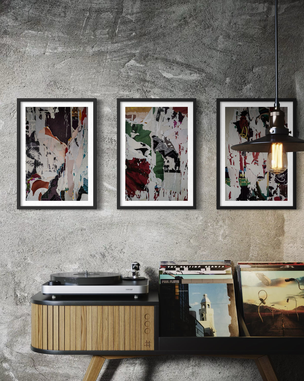 Black-and-white photographic paste-ups displayed above a record player and vinyl on a textured wall.