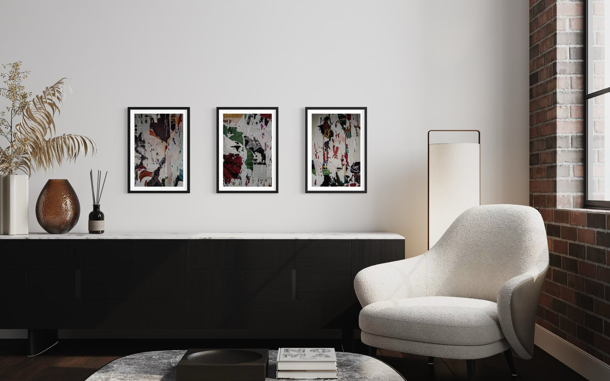 White chair and vases beside a black console table, Paste-Ups Photographic Installation displayed above.