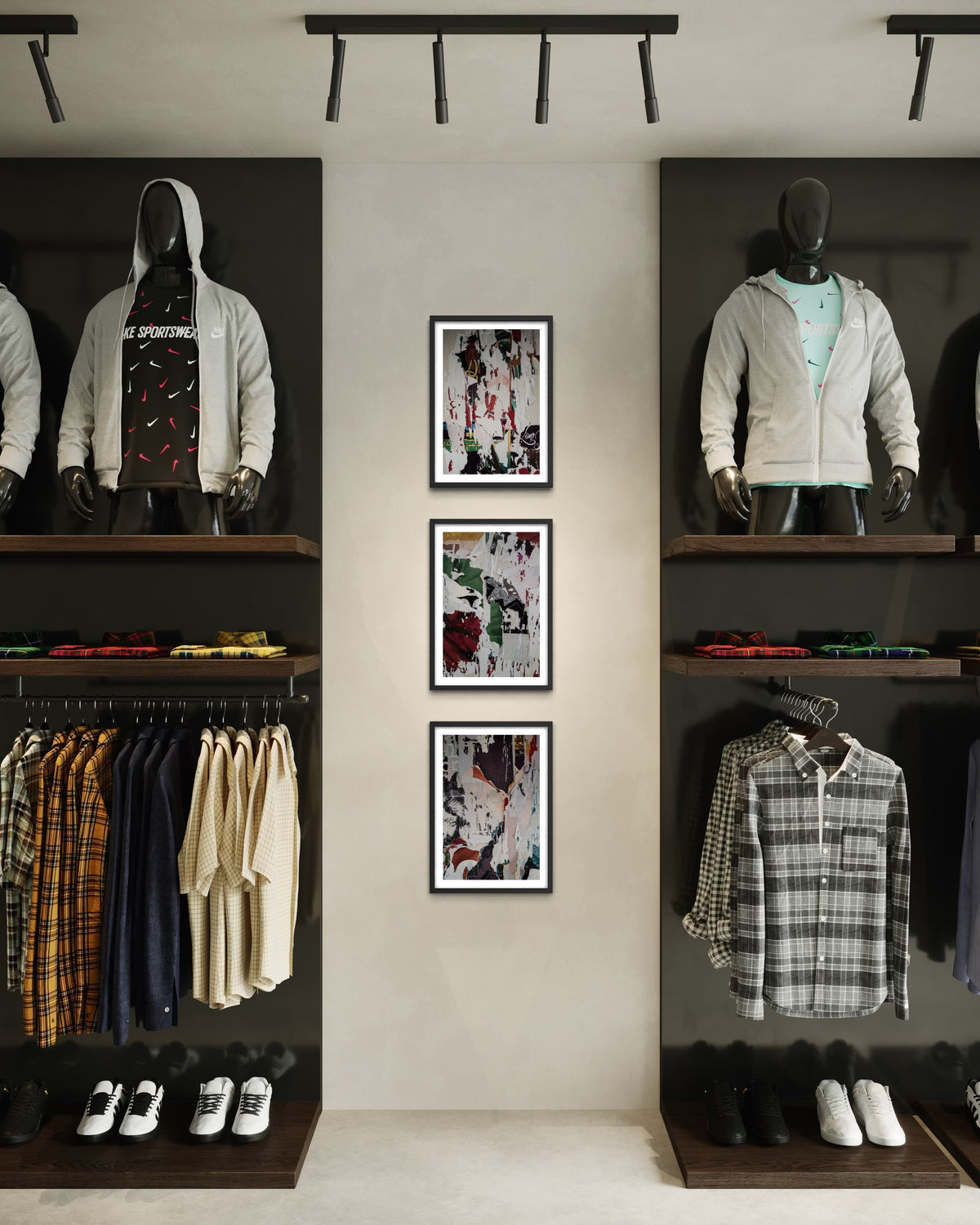 Clothing store interior with mannequins, folded shirts, and three Paste-Ups photo installations on the wall.