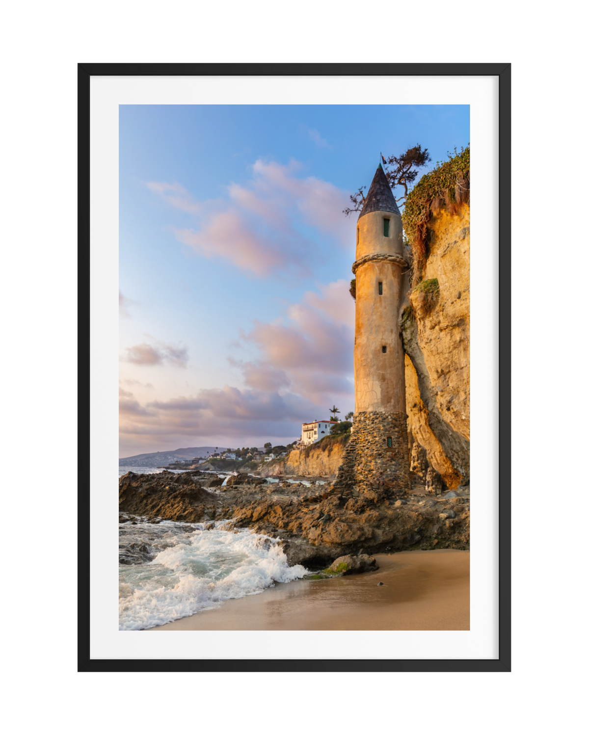 Pirate Tower, a tall stone structure, stands against Laguna Beach’s cliffs by the ocean.