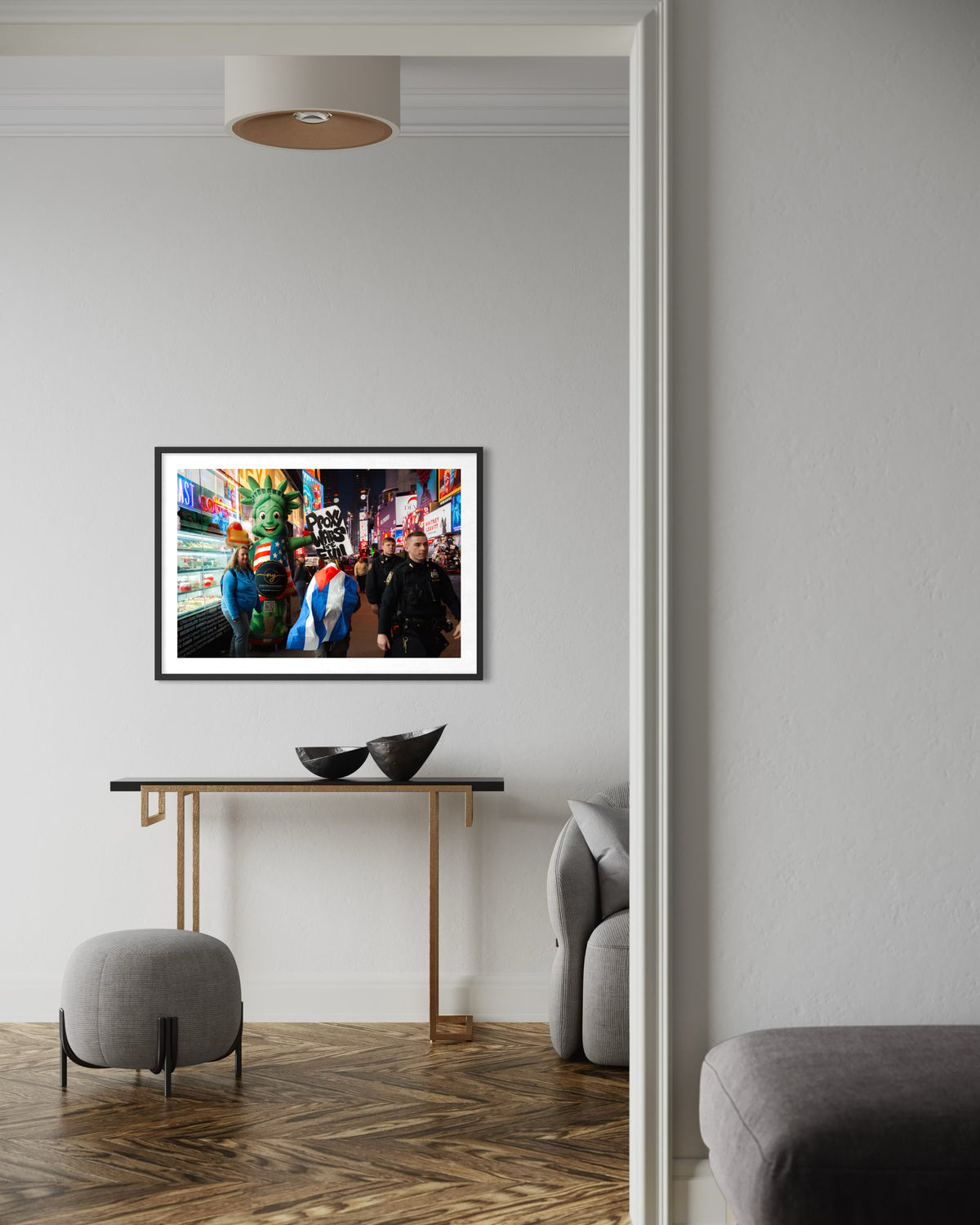 Framed “Proxy Wars Are Evil” cityscape photograph displayed above a black console table in a modern living room.