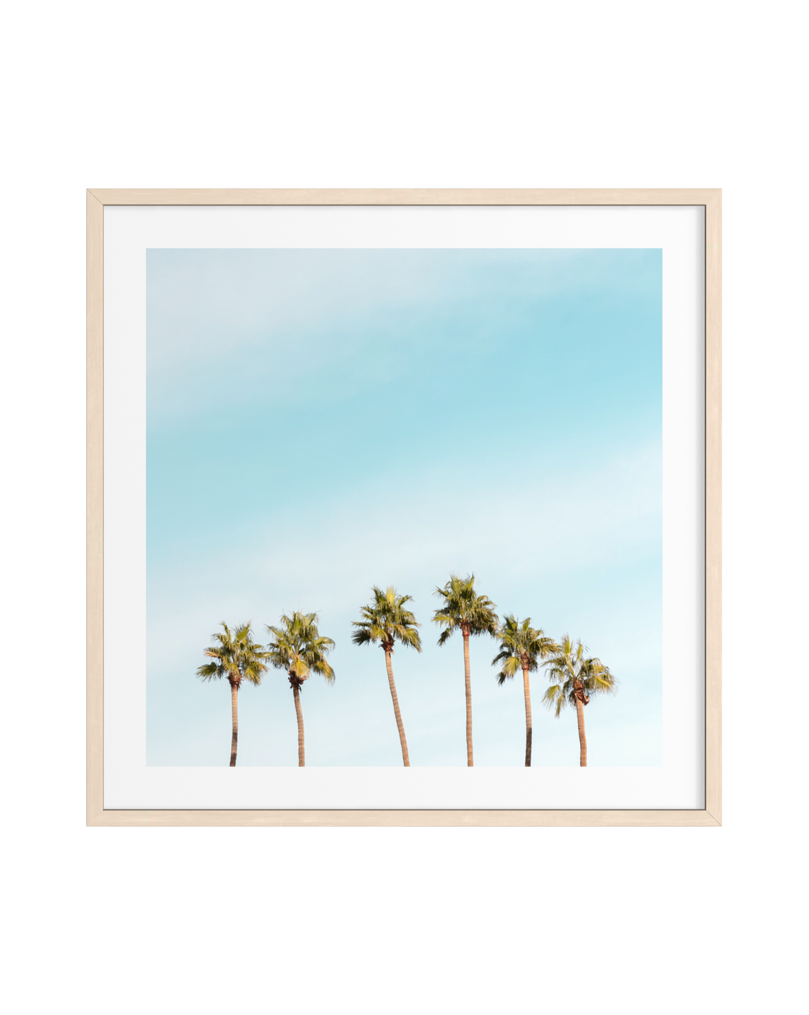 Six tall palm trees under a clear blue sky in Palm Springs, framed in light wood.