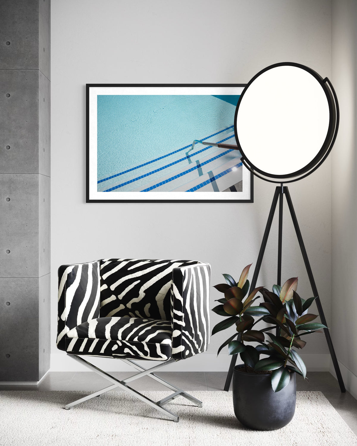 Framed print of The Hotel Pool photograph displayed above a zebra chair, palm plant, and floor lamp.