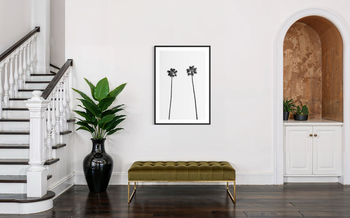 Entryway with stairs, a green bench, Twin Palms art above a plant nook; Palm Springs photography print.